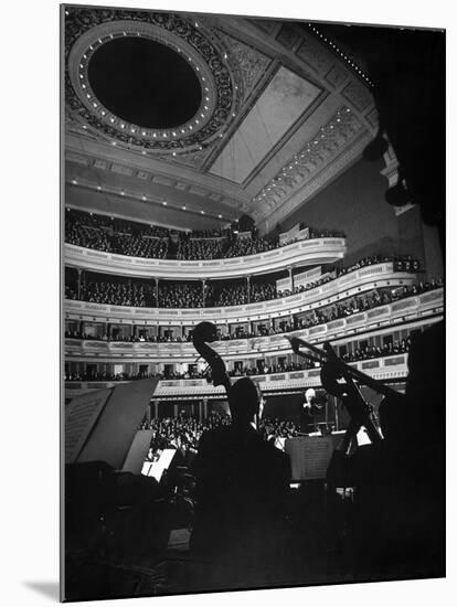 Leopold Stokowski Conducting the New York Philharmonic Orchestra at Carnegie Hall-Gjon Mili-Mounted Premium Photographic Print