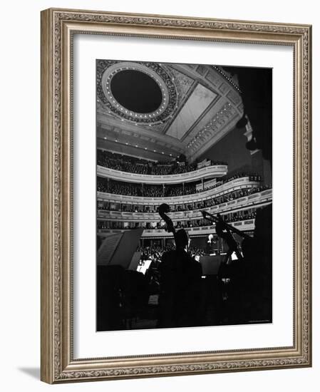 Leopold Stokowski Conducting the New York Philharmonic Orchestra in Performance at Carnegie Hall-Gjon Mili-Framed Premium Photographic Print