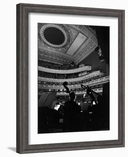 Leopold Stokowski Conducting the New York Philharmonic Orchestra in Performance at Carnegie Hall-Gjon Mili-Framed Premium Photographic Print