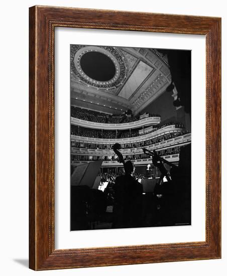 Leopold Stokowski Conducting the New York Philharmonic Orchestra in Performance at Carnegie Hall-Gjon Mili-Framed Premium Photographic Print