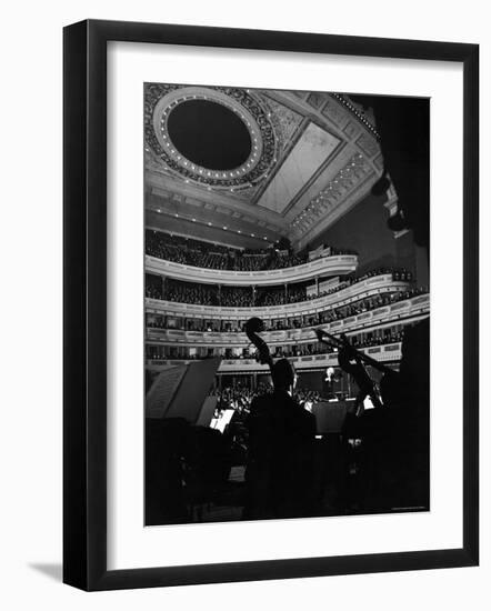 Leopold Stokowski Conducting the New York Philharmonic Orchestra in Performance at Carnegie Hall-Gjon Mili-Framed Premium Photographic Print