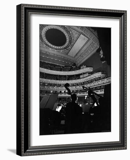 Leopold Stokowski Conducting the New York Philharmonic Orchestra in Performance at Carnegie Hall-Gjon Mili-Framed Premium Photographic Print