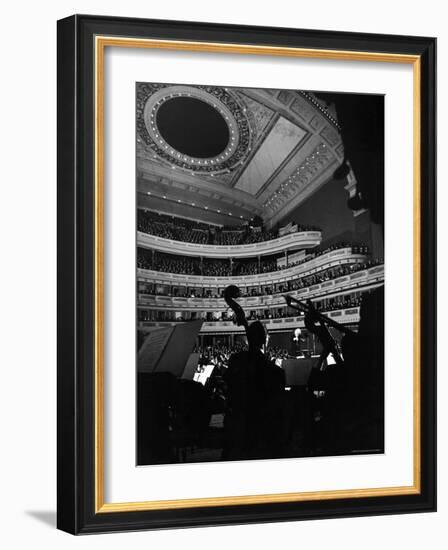 Leopold Stokowski Conducting the New York Philharmonic Orchestra in Performance at Carnegie Hall-Gjon Mili-Framed Premium Photographic Print