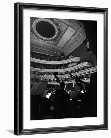 Leopold Stokowski Conducting the New York Philharmonic Orchestra in Performance at Carnegie Hall-Gjon Mili-Framed Premium Photographic Print