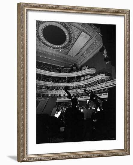 Leopold Stokowski Conducting the New York Philharmonic Orchestra in Performance at Carnegie Hall-Gjon Mili-Framed Premium Photographic Print