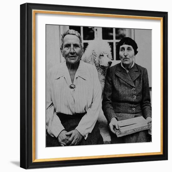 Lesbian Authors Gertrude Stein and Alice B. Toklas with their Poodle Basket II-Carl Mydans-Framed Premium Photographic Print