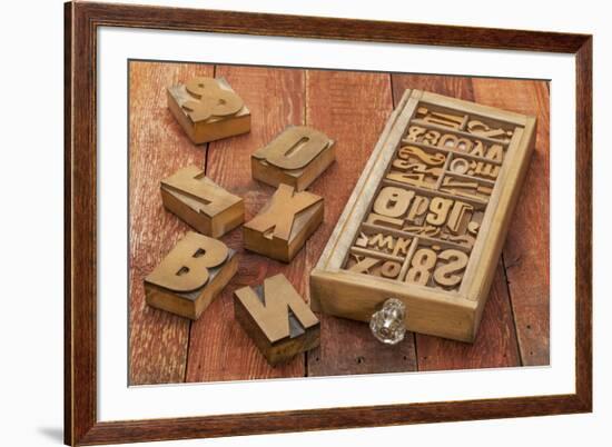 Letterpress Wood Type Blocks in a Typesetter Drawer against Rustic Red Barn Wood-PixelsAway-Framed Art Print