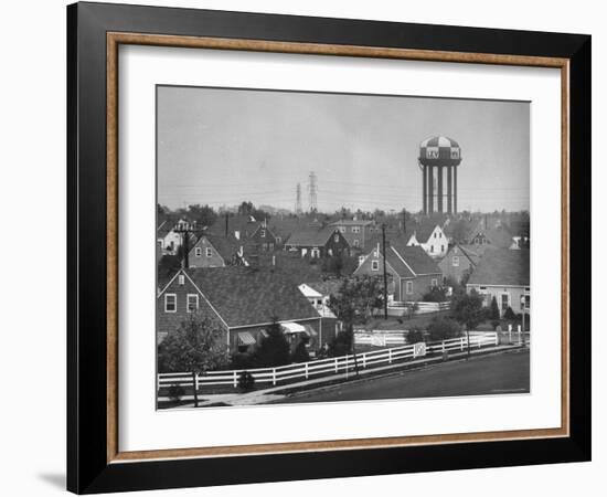 Levittown Water Tank Looming over Middle Class Homes in New Housing Development-Joe Scherschel-Framed Photographic Print