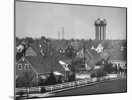 Levittown Water Tank Looming over Middle Class Homes in New Housing Development-Joe Scherschel-Mounted Photographic Print