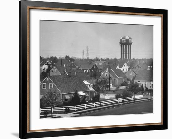 Levittown Water Tank Looming over Middle Class Homes in New Housing Development-Joe Scherschel-Framed Photographic Print