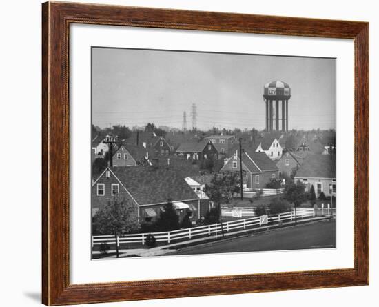 Levittown Water Tank Looming over Middle Class Homes in New Housing Development-Joe Scherschel-Framed Photographic Print