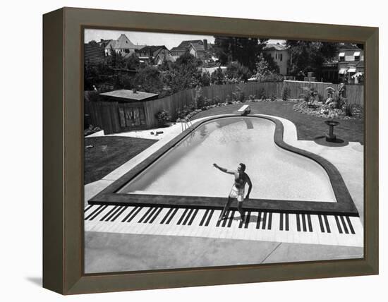 Liberace at the 'Piano' Shaped Pool in His Home-Loomis Dean-Framed Premier Image Canvas