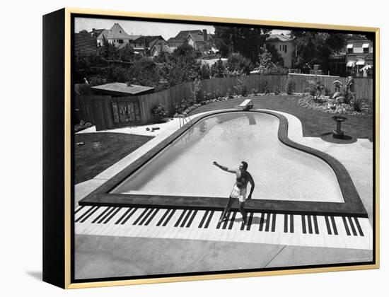 Liberace at the 'Piano' Shaped Pool in His Home-Loomis Dean-Framed Premier Image Canvas