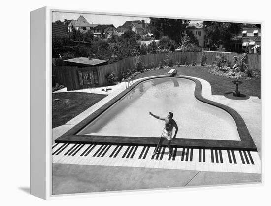 Liberace at the 'Piano' Shaped Pool in His Home-Loomis Dean-Framed Premier Image Canvas
