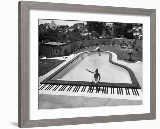 Liberace at the 'Piano' Shaped Pool in His Home-Loomis Dean-Framed Premium Photographic Print