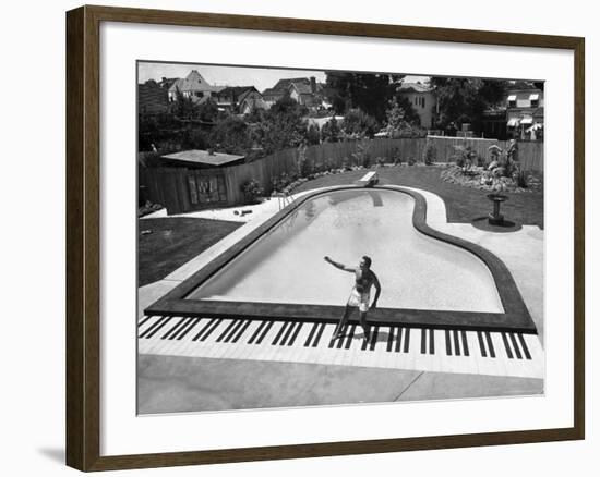 Liberace at the 'Piano' Shaped Pool in His Home-Loomis Dean-Framed Premium Photographic Print