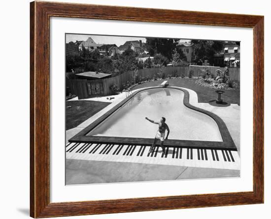 Liberace at the 'Piano' Shaped Pool in His Home-Loomis Dean-Framed Premium Photographic Print