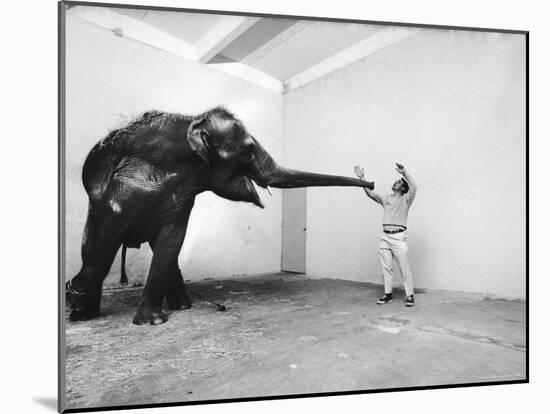 Life Photographer Arthur Schatz with Elephant While Shooting Story on the Franklin Park Zoo-Arthur Schatz-Mounted Photographic Print