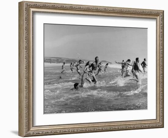 Lifeguards and Members of Womens Swimming Team Start Day by Charging into Surf-Peter Stackpole-Framed Photographic Print