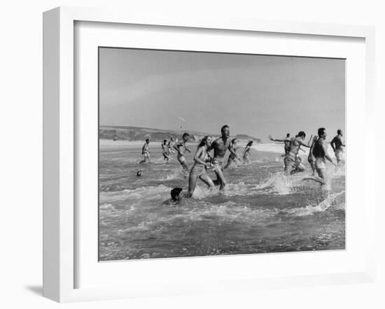 Lifeguards and Members of Womens Swimming Team Start Day by Charging into Surf-Peter Stackpole-Framed Photographic Print