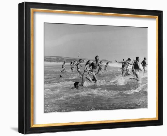 Lifeguards and Members of Womens Swimming Team Start Day by Charging into Surf-Peter Stackpole-Framed Photographic Print