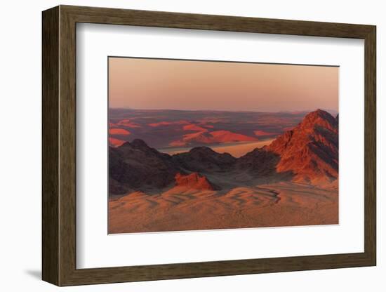 Light illuminates the Naukluft Mountains and Namib Desert at sunrise. Namibia.-Sergio Pitamitz-Framed Photographic Print