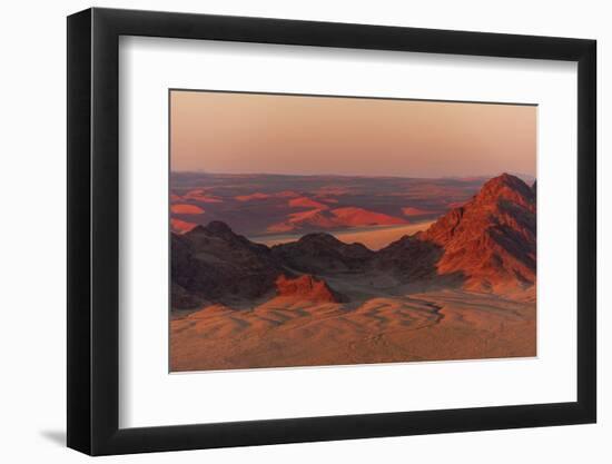 Light illuminates the Naukluft Mountains and Namib Desert at sunrise. Namibia.-Sergio Pitamitz-Framed Photographic Print