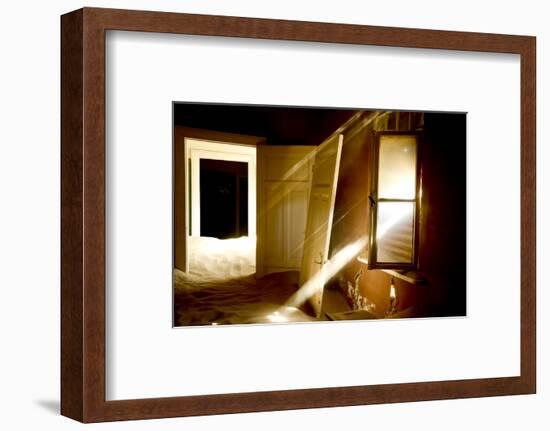 Light Streaming Through Window On Sand Covered House In Kolmanskop Ghost Town-Enrique Lopez-Tapia-Framed Photographic Print