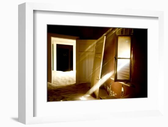 Light Streaming Through Window On Sand Covered House In Kolmanskop Ghost Town-Enrique Lopez-Tapia-Framed Photographic Print