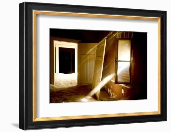 Light Streaming Through Window On Sand Covered House In Kolmanskop Ghost Town-Enrique Lopez-Tapia-Framed Photographic Print