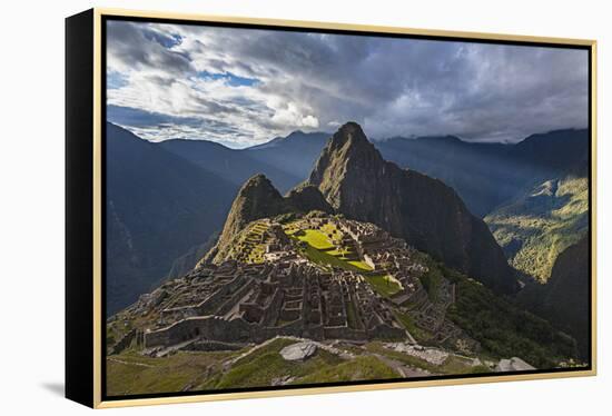 Light Streams Through The Clouds And Lights Parts Of The Ancient City Of Machu Picchu-Joe Azure-Framed Premier Image Canvas