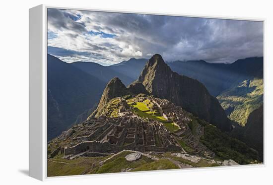Light Streams Through The Clouds And Lights Parts Of The Ancient City Of Machu Picchu-Joe Azure-Framed Premier Image Canvas