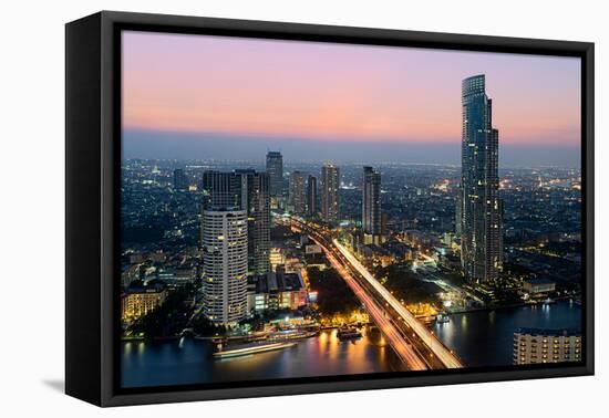 Light trails and skyscrapers at dusk, Bangkok, Thailand, Southeast Asia, Asia-Logan Brown-Framed Premier Image Canvas