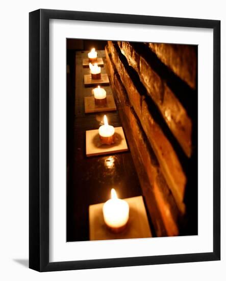 Lighted Candles and Brick Wall-Michele Molinari-Framed Photographic Print