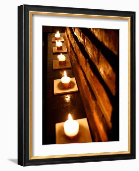 Lighted Candles and Brick Wall-Michele Molinari-Framed Photographic Print