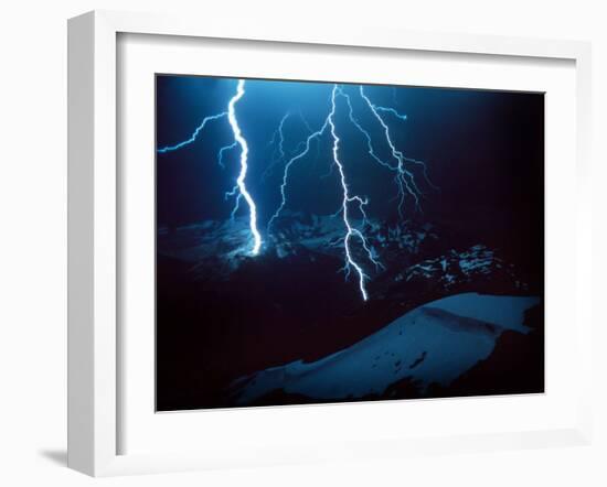 Lightning During a Storm over Snowy Mountains-null-Framed Photo