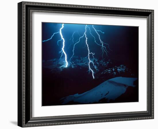 Lightning During a Storm over Snowy Mountains-null-Framed Photo