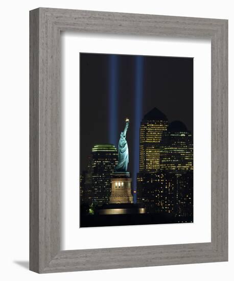 Lights from the Former World Trade Center Site Can be Seen on Both Sides of the Statue of Liberty-null-Framed Photographic Print