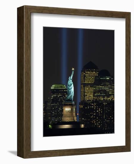 Lights from the Former World Trade Center Site Can be Seen on Both Sides of the Statue of Liberty-null-Framed Photographic Print