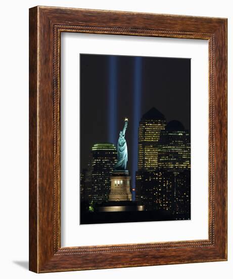 Lights from the Former World Trade Center Site Can be Seen on Both Sides of the Statue of Liberty-null-Framed Photographic Print