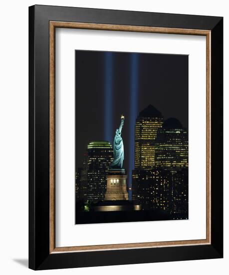 Lights from the Former World Trade Center Site Can be Seen on Both Sides of the Statue of Liberty-null-Framed Photographic Print