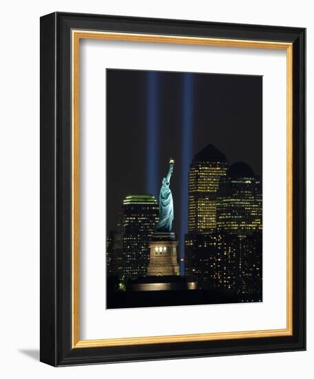 Lights from the Former World Trade Center Site Can be Seen on Both Sides of the Statue of Liberty-null-Framed Photographic Print