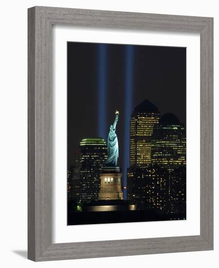 Lights from the Former World Trade Center Site Can be Seen on Both Sides of the Statue of Liberty-null-Framed Photographic Print