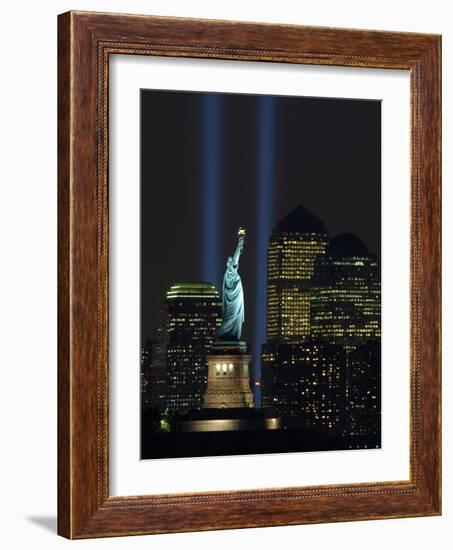 Lights from the Former World Trade Center Site Can be Seen on Both Sides of the Statue of Liberty-null-Framed Photographic Print