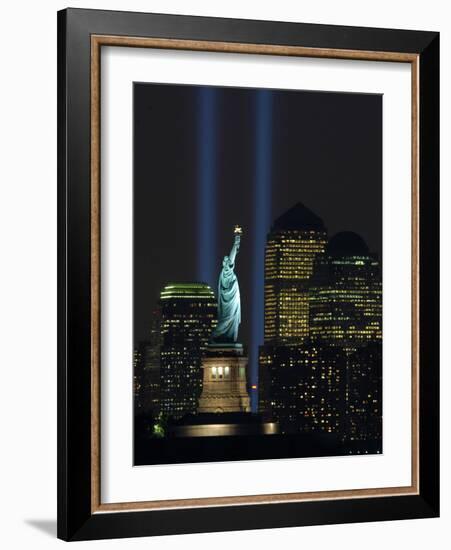 Lights from the Former World Trade Center Site Can be Seen on Both Sides of the Statue of Liberty-null-Framed Photographic Print