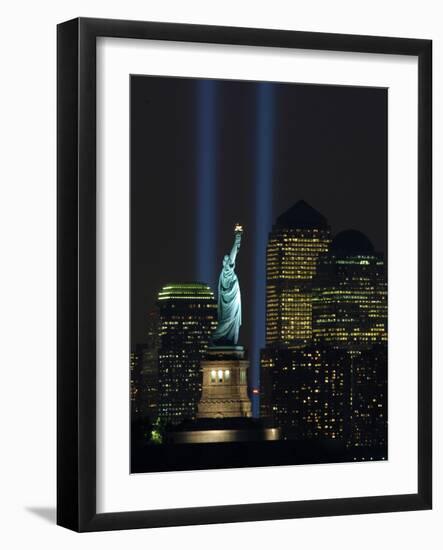 Lights from the Former World Trade Center Site Can be Seen on Both Sides of the Statue of Liberty-null-Framed Photographic Print