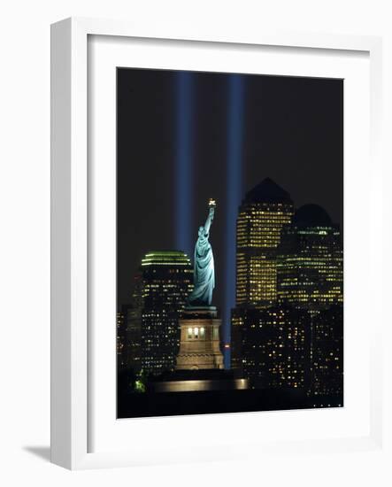 Lights from the Former World Trade Center Site Can be Seen on Both Sides of the Statue of Liberty-null-Framed Photographic Print