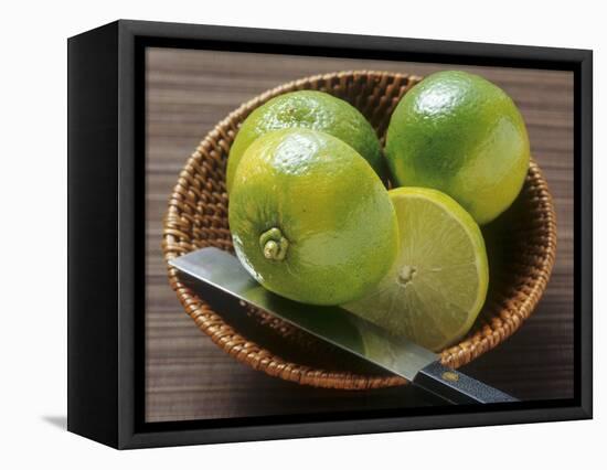 Limes, Two Whole and One Halved in a Small Basket-Eising Studio - Food Photo and Video-Framed Premier Image Canvas