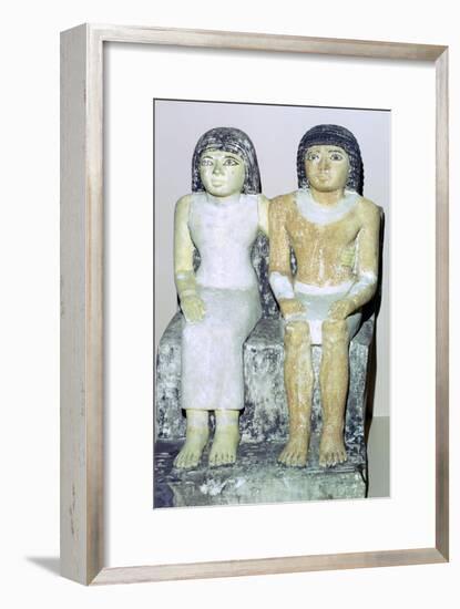 Limestone Egyptian statue of a man and his wife. Artist: Unknown-Unknown-Framed Giclee Print