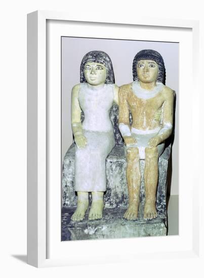Limestone Egyptian statue of a man and his wife. Artist: Unknown-Unknown-Framed Giclee Print